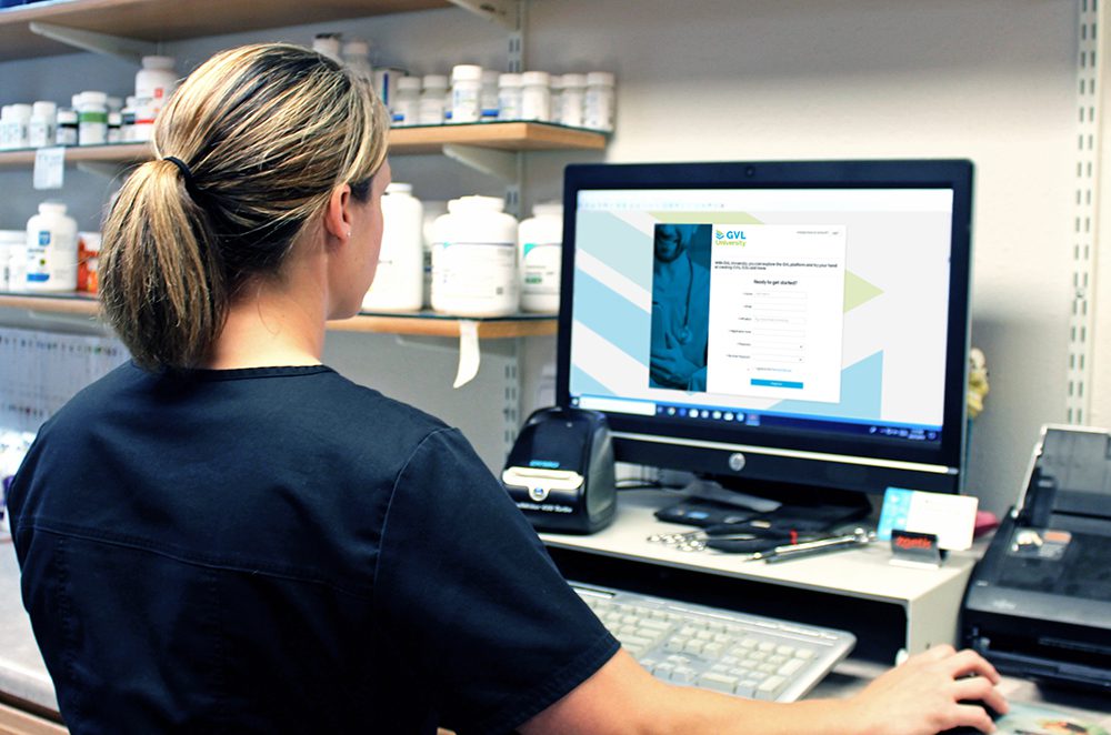 veterinarian with computer