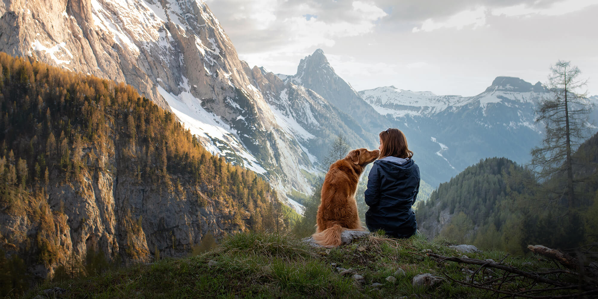 Woman with dog on a hike